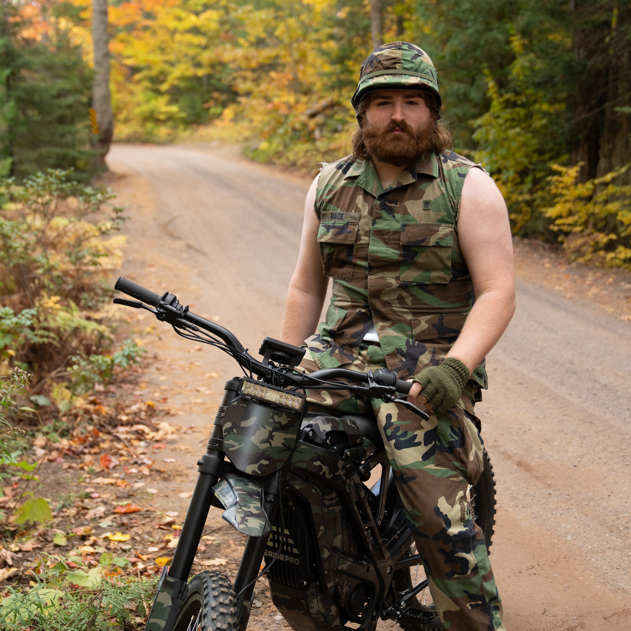 Handsome camoflauged man riding E Ride Pro SS 2.0 Electric Bike