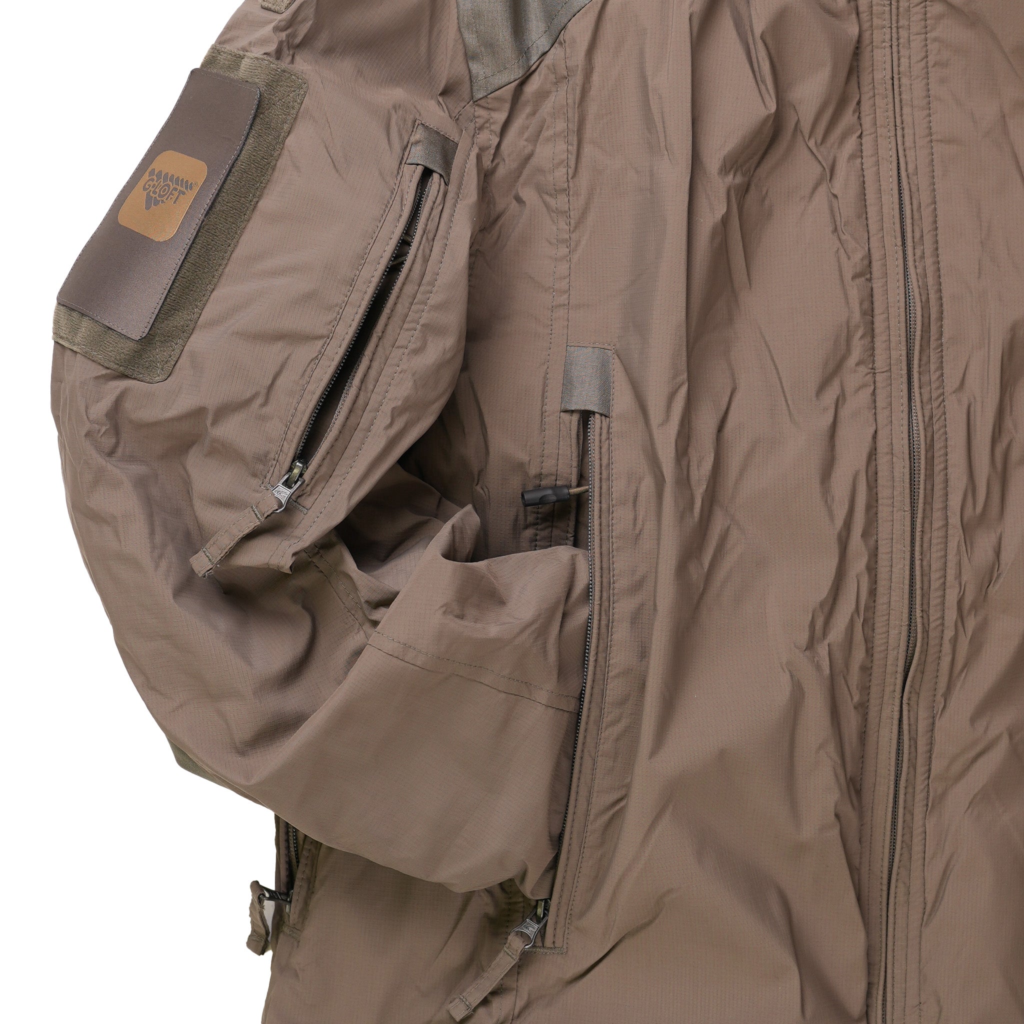 Close-up of a brown jacket with a patch on a white background
