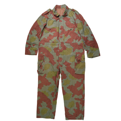 Camouflage jumpsuit with pink, yellow, and green pattern on a white background